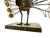 This vintage Mid Century metal peacock is a dazzling spectacle of craftsmanship. The piece features a fan of plumes, each...