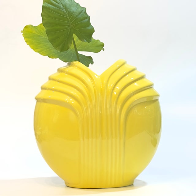 This oversized vintage sculptural ceramic vase features a striking, geometric stepped motif that beautifully captures...