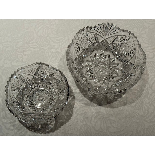 This pair of hand cut crystal bowls is from the late 19th century, the American Brilliant Period. The large bowl measures...