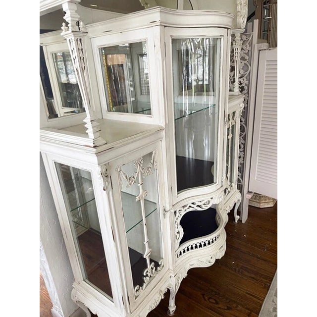A truly magnificent and monumental 19th-century English antique display cabinet (curio cupboard), masterfully crafted with...