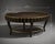 A striking vintage oval coffee table by Decca, thoughtfully refinished in a rich dark antique brass tone with hand-applied...