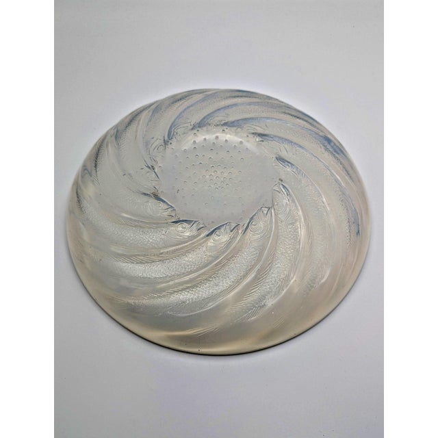 An exquisite art deco opalescent molded glass plate titled "poisson n°1", designed by rené lalique in france, circa 1931....
