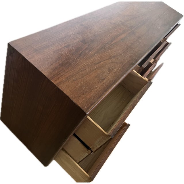 Beautiful bookmatched waterfall rosewood and walnut 9-drawer dresser by Lane Furniture Company for Henry M. Goodman....