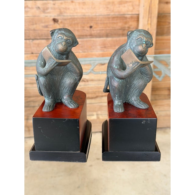 Bring a touch of whimsical sophistication to your library or study with this charming pair of vintage monkey bookends...