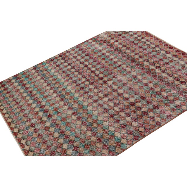 This vintage 4x5 Art Deco rug, hand-knotted in wool, circa 1960-1970, features a mid-century take on Art Deco and cubist...