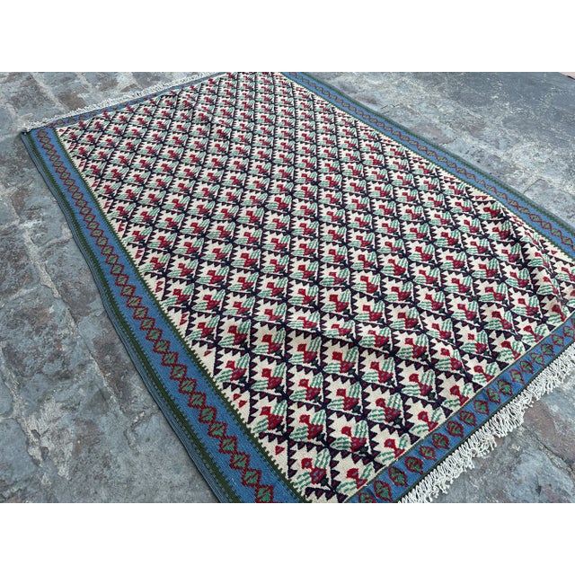 This Vintage Flat Weave Kilim would make a beautiful decor addition to your house. This is composed of 100% wool and is...
