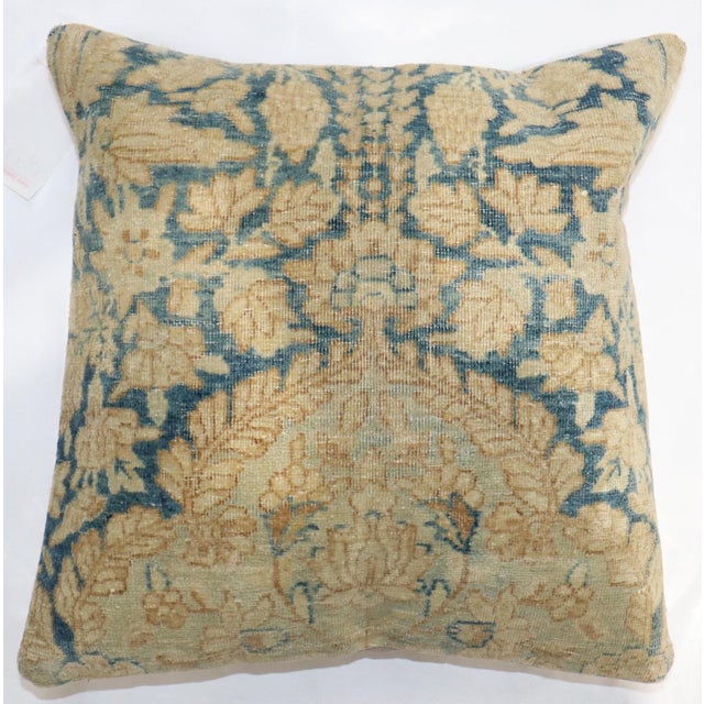 A pillow made from an old persian blue and gold kerman