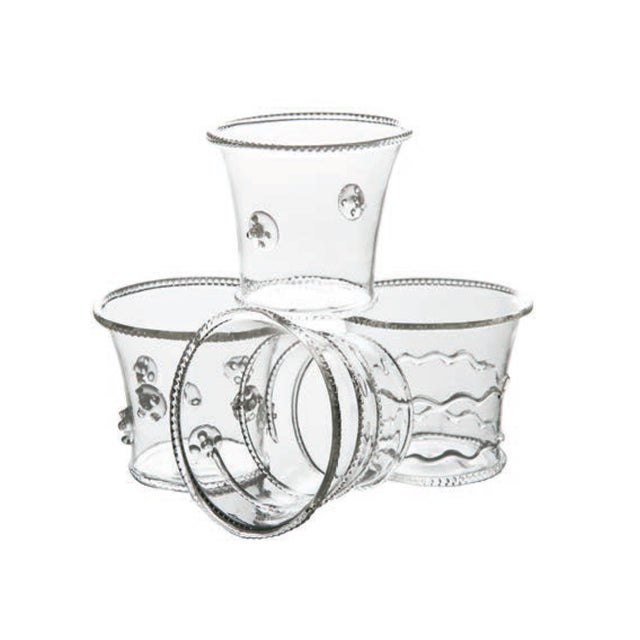 Four different decorations are applied on these small glass votive cups. Especially attractive used in groups....