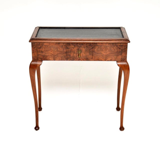 A beautiful and quite unusual antique burr walnut leather top console / side table. This was made in England, it dates...
