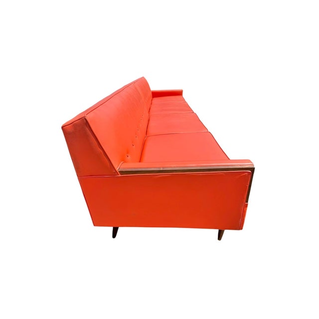 Make a dramatic mid-century statement with this exceptional 1960s orange and walnut two-piece sectional sofa. Upholstered...