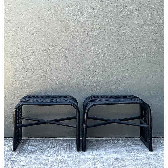 Elevate your space with this striking pair of vintage stick rattan stools, featuring a sophisticated waterfall edge...