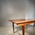 An elegant Scandinavian dining table from the 1960s-1970s in teak veneer, with a simple and timeless design. It is...