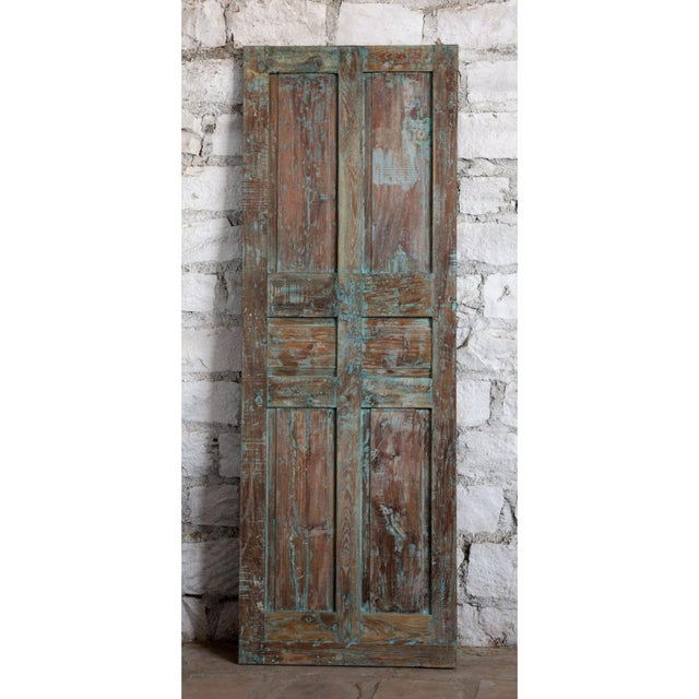 Bring timeless character to your home with this beautifully hand-carved antique door, finished in a soft dusty blue patina...