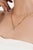 This modern paperclip chain necklace features a 2.26 carat emerald-cut aquamarine, set in 14K yellow gold. The center...