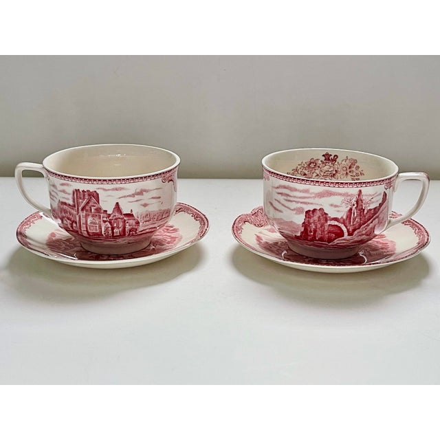Cup measures 4 3/4 inches from handle to rim, 2 inches at the foot and 2 3/4 inches tall. Saucer measures 5 3/4 inches in...