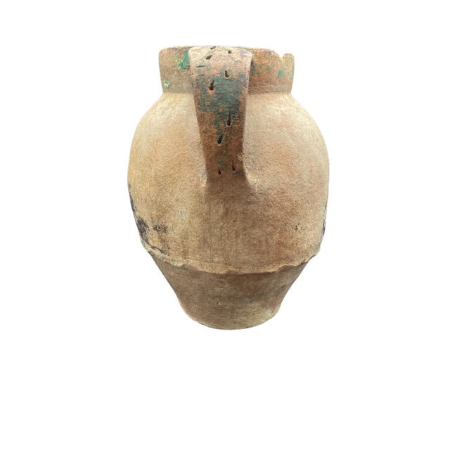 Antique terracotta water pot or vessel. Has definitely wear and patina due to age.