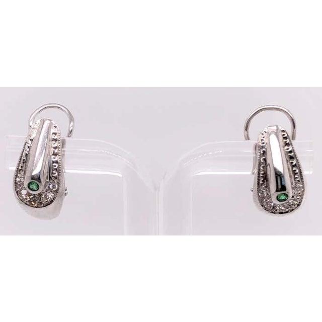 18 Karat White Gold Earrings Emerald Center With Diamond Accents French Back. 0.50 total diamond weight. 6.31 grams total...