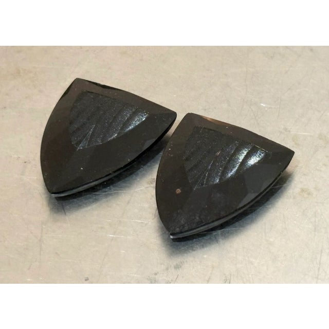 1920s-30s art deco black bakelite shoe clips or brooches; set of two. Some mild surface wear to bakelite consistent with...