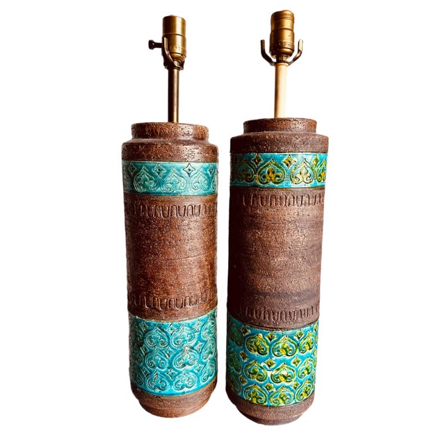Lovely pair of 1960's stoneware table lamps encircled with bands of Rimini Blue glaze by Aldo Londi for Bitossi. These...