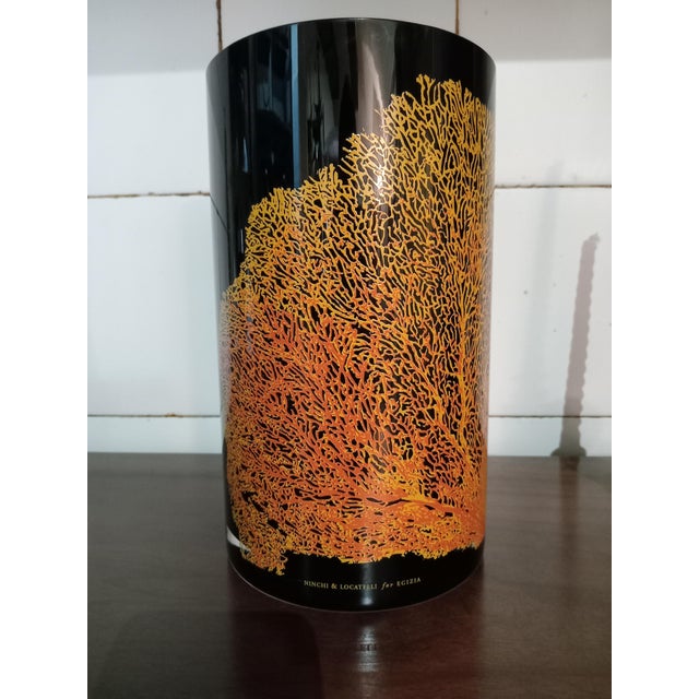 Glass vase with black glass casing and yellow/red silkscreen print depicting corals, series called Acquaria, designed by...