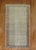 an early 20th Century Persian Tabriz Rug with a repetitive small paisley design on a light color field. accents in light...