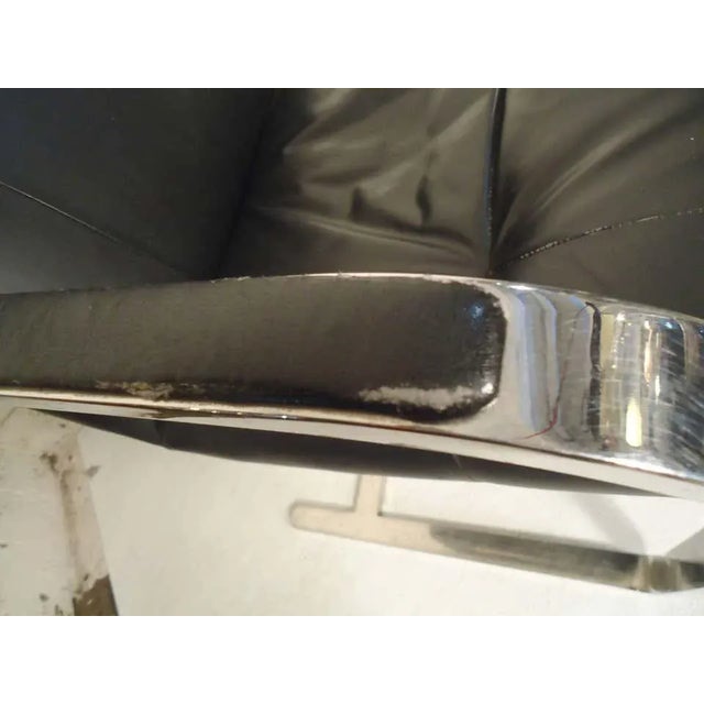 Pair of polished chrome chairs with cantilever base. Made by Brueton, featuring handsome lines and comfortable cushioned...