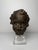 This 16th-century Tuscan terracotta sculpture depicts the head of a cherub with expressive style, strongly modeled facial...