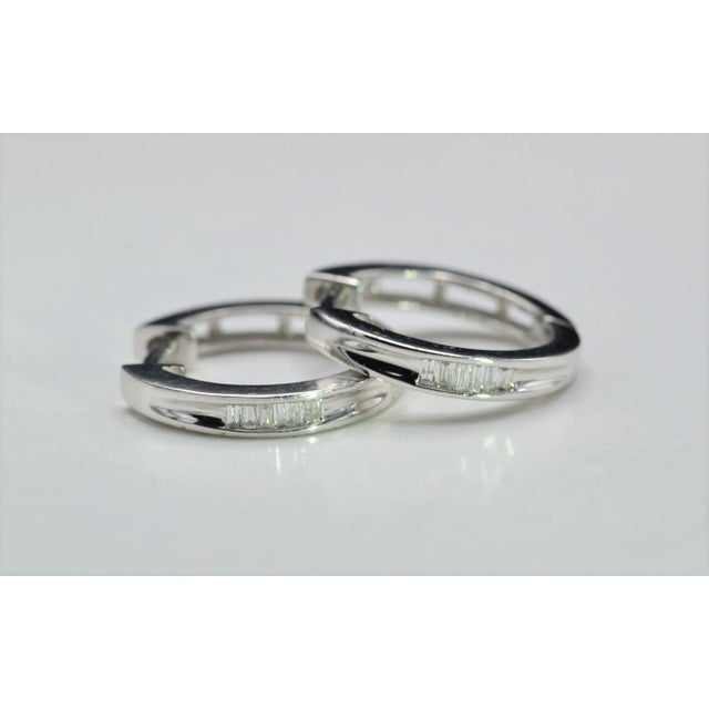 The Anaheims Ladies White Gold Hoop Earrings set with Diamonds. Crafted in white gold, these simple hoop style earrings...