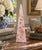 A beautifully proportioned marble obelisk in richly veined shades of pink and cream. The sculptural silhouette and...