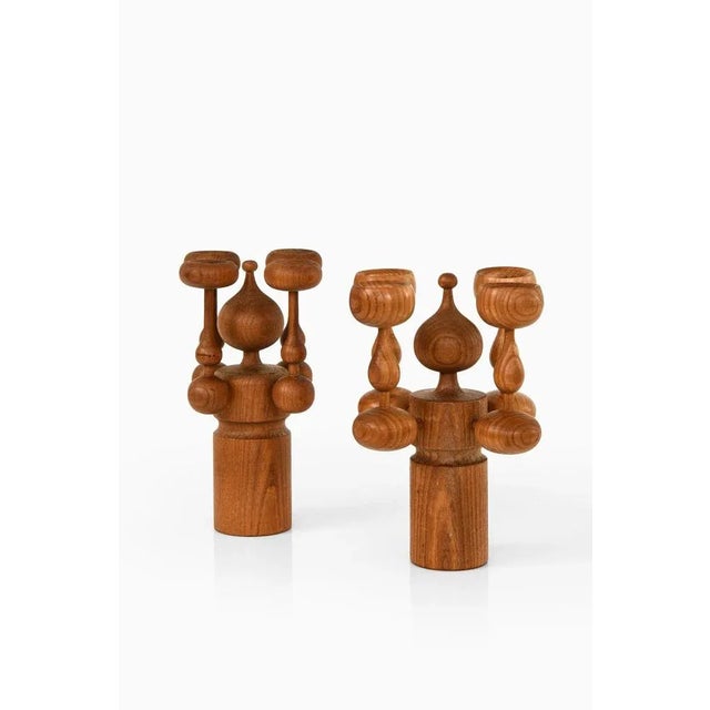 Pair of candlesticks in teak by erik höglund, 1950's additional information: material: teak style: mid century,...