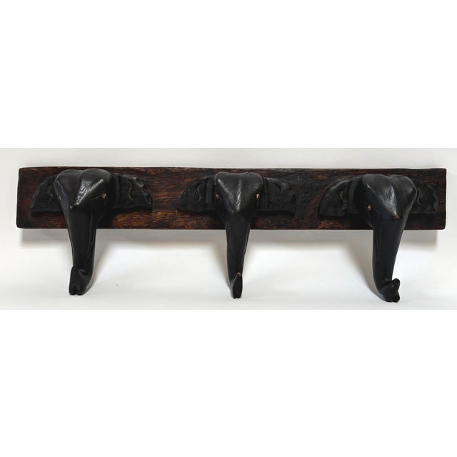 Hand-Carved Wooden Elephant Wall Coat Rack, Triple Head Hooks, Asian African Style A beautifully hand-carved wooden wall...