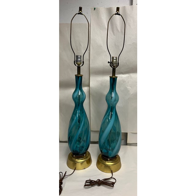 Fine pair of Murano blue swirl glass table lamps. Set on gilt bases.