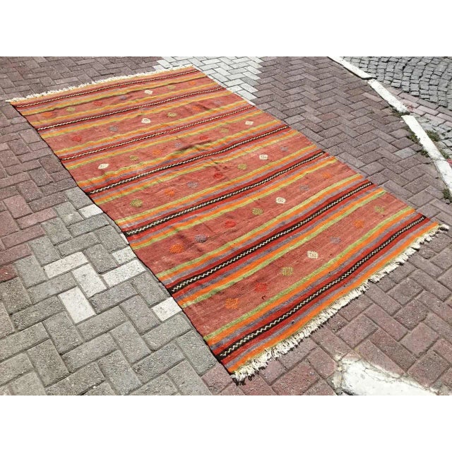 This beautiful, vintage, handwoven kilim is approximately 60 years old. It is handmade of very fine quality, hand-spun...