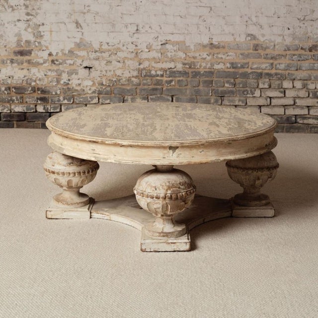 A 19th-century French coffee table crafted from solid oak and finished in a painted surface with a naturally aged patina....