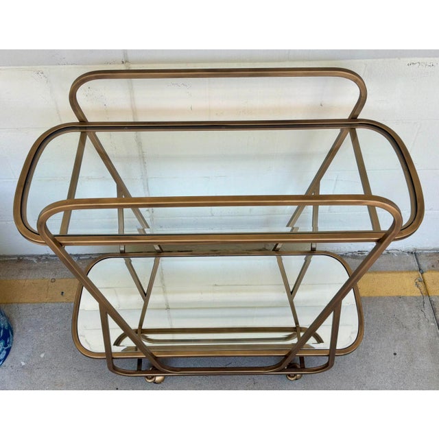 Stylish Swain Co. Modern Antique Brass Bar Cart, mirrored lower shelf, glass top, showroom floor sample