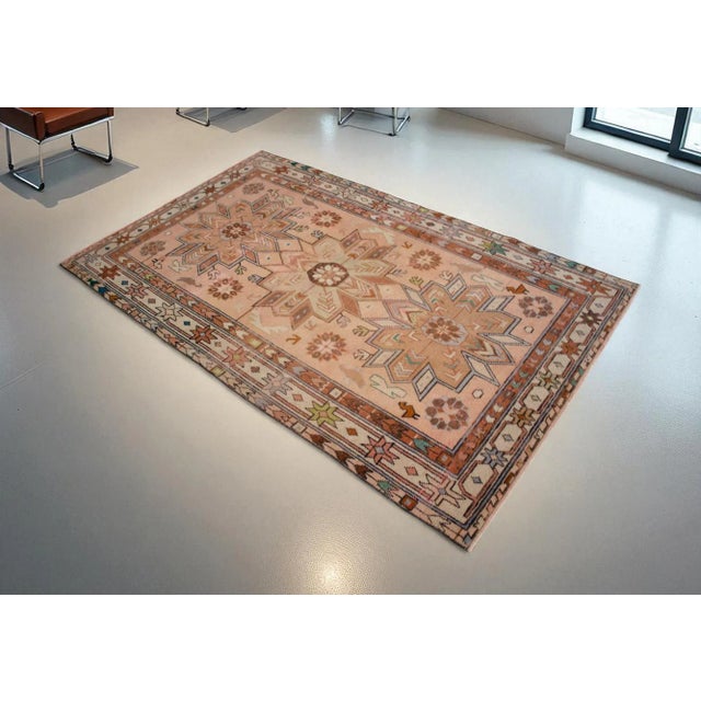 This is a beautiful vintage hand knotted distressed finish rug from turkey. It has primary colors on cashmere field . This...