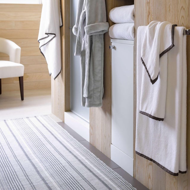 With its classic ticking stripes in varied shades of grey, this indoor/outdoor flatwoven rug makes the grade. Crafted in...