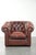 This amazing English-style cowhide Chesterfield armchair fits into both classic and modern interiors and looks perfect in...