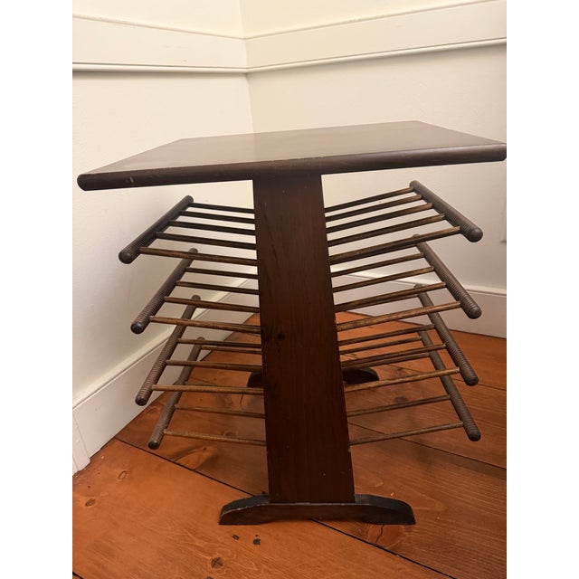 This is a vintage mid century modern magazine rack styled after those produced by Josef Frank or Edward Wormsley. It...