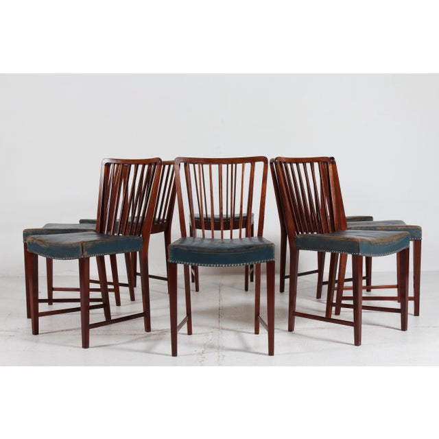 A stunning set of 8 art deco dining chairs. handcrafted and designed by fritz hansen a/s in denmark in the 1940s. stamped...