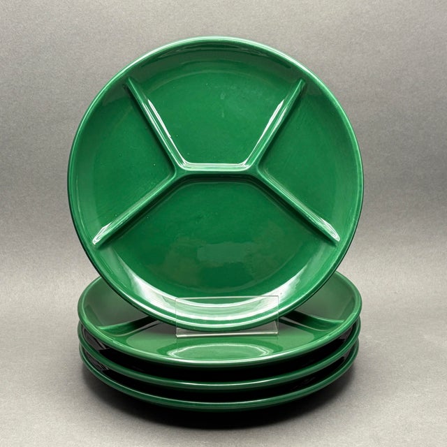 • This set includes four vibrant emerald green ceramic divided plates, each featuring a classic mid-century three-section...