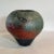 Mid-Century Hand Thrown Raku Pottery Vase in Bulbous Form in Shades of Turquoise and Rust Measures approx: 9H x 9D Please...