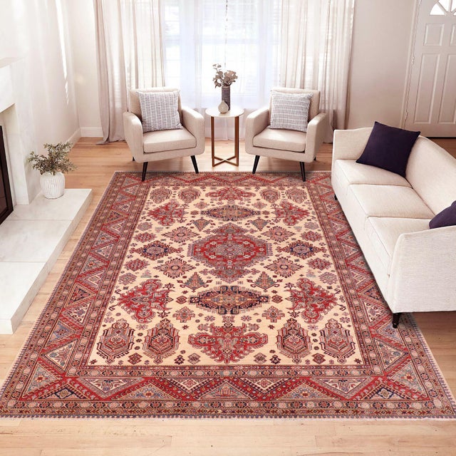 Enhance your home with this exquisite hand-knotted Super Kazak rug, crafted from fine hand-spun wool and dyed with all-...