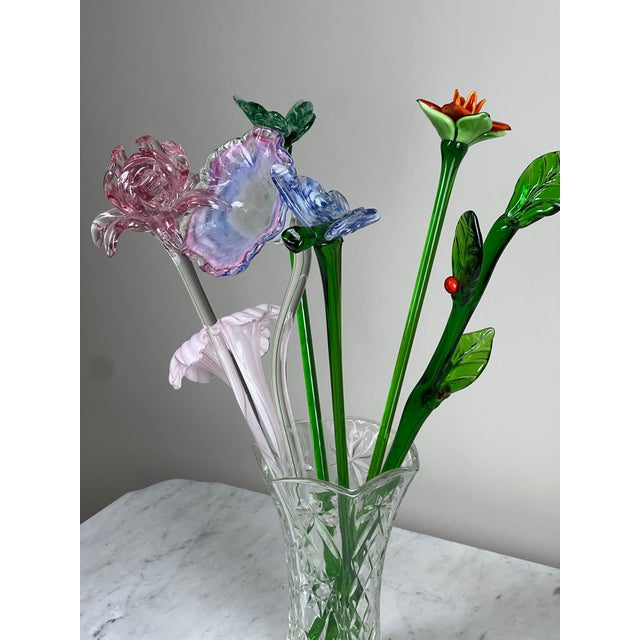 This charming bouquet of long-stemmed Murano art glass flowers brings a burst of color and artistry to any space. Each...