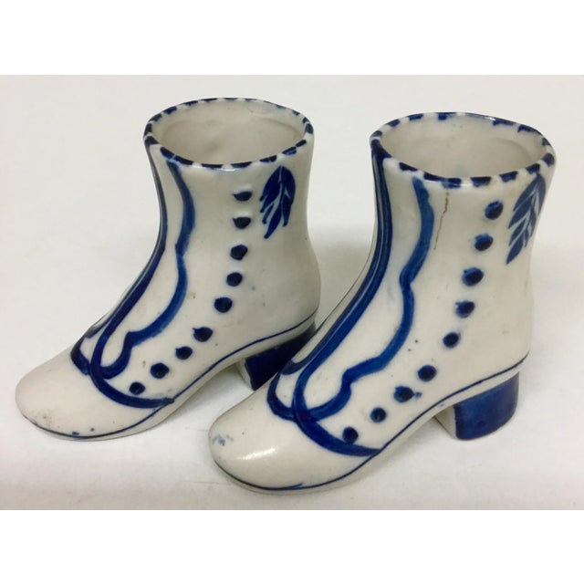 This cute set of porcelain shoes is perfect for someone who likes to collect small knick knack treasures. Use them to grow...