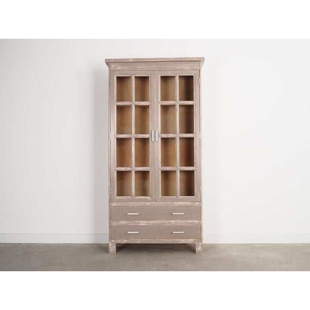 The showcase was made in the 1980s, Danish production. The structure is made of oak wood. The legs are made of solid wood,...