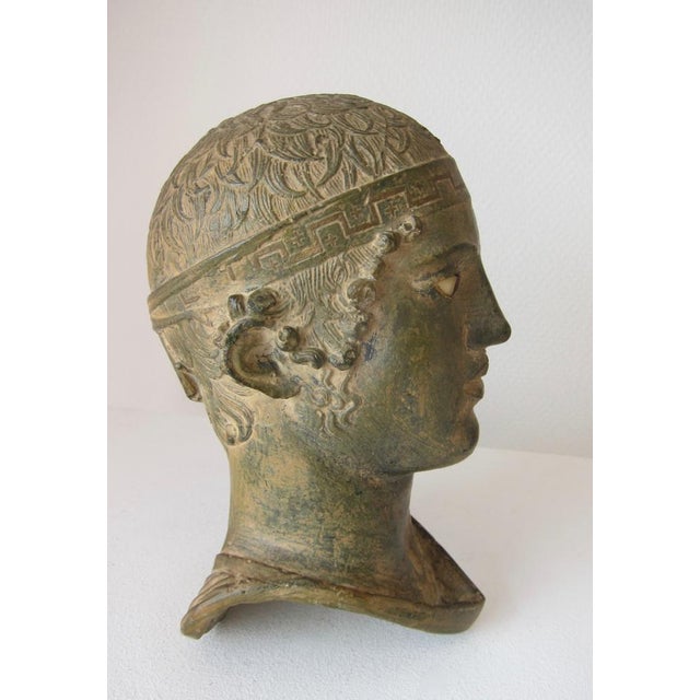 Lovely & very well made reproduction of the Charioteer of Delphi from Italy made in the 1950's. Beautiful bronze patina....