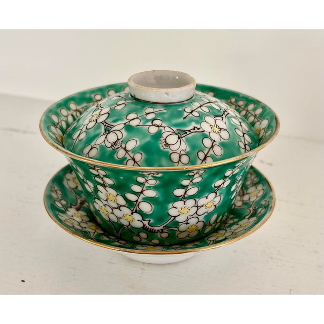 Vintage Chinese 4 piece tea cup “Gaiwan” set. Enamel‑decorated tea set featuring a lidded tea-cup, saucer and small plate....