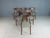 Elegant set of Danish dining chairs, featuring a teak frame. Seen from the side, the seat's frame that flows over to the...