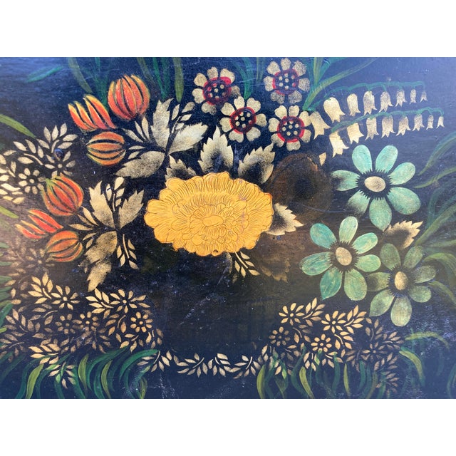 Charming large rectangular antique tole tray with a floral center and flowers accenting the outer rim. Two cutout handles....